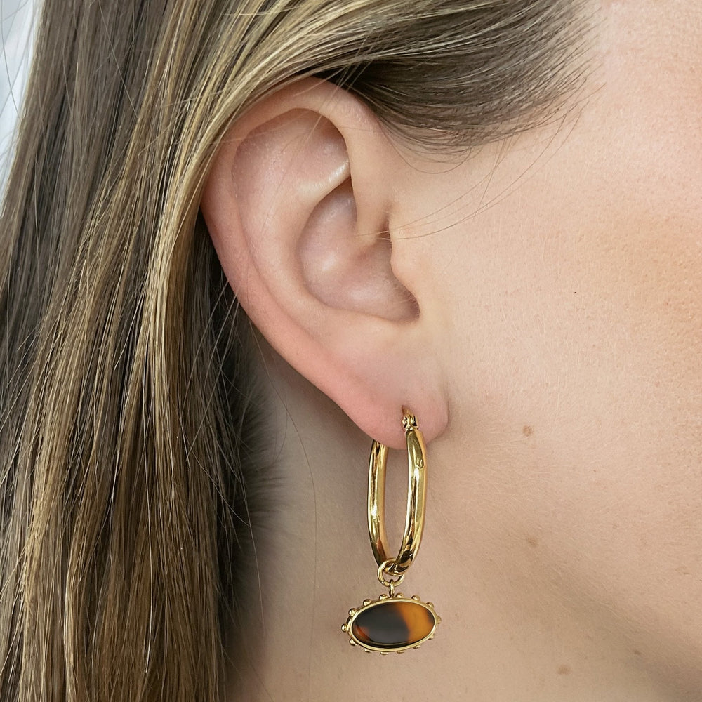 CLUSE Essentielle Oval Charm Hoop Earrings, Gold Colour CE13322 - Earrings on ear